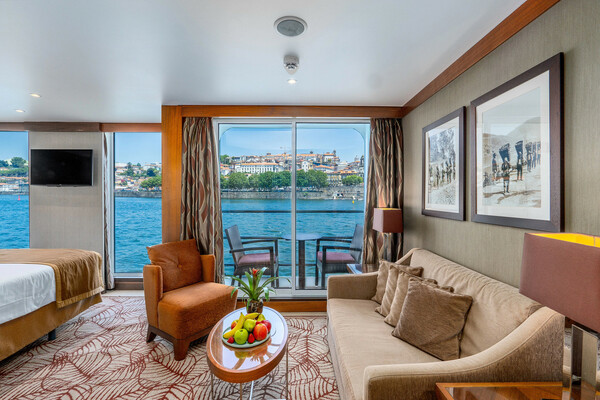 Amawaterways AmaVida Suite Lounge and bedroom ©Bruno Barreira & Amawaterways.jpeg